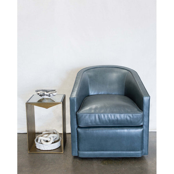 The Radcliffe Swivel Chair is one of our favorites for comfort and looks.   It features a curved barrel back with sloped arms.  This chair works well with fabric or leather. Duvall Atelier