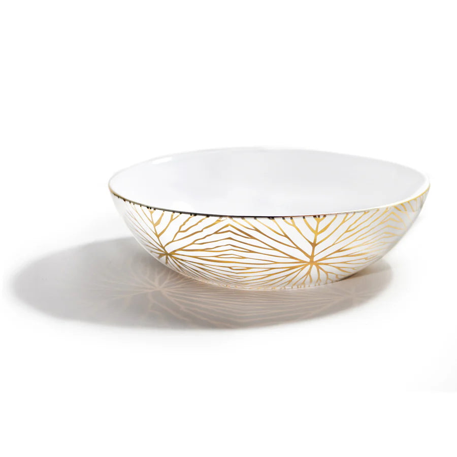 Our Lily Pad low serving bowl is inspired by the organic branching of the Giant Lily Pad, a surprisingly delicate, yet strong, plant found in the Amazon. Designed to bring celebration to your dining table, it serves roasted vegetables, pastas and even fish with ease. Host, beautify, and thrive at home with this stunning bowl, patterned in 24K gold.

Ceramic with 24K Gold detail
12" x 12" x 3.25"H
Imported