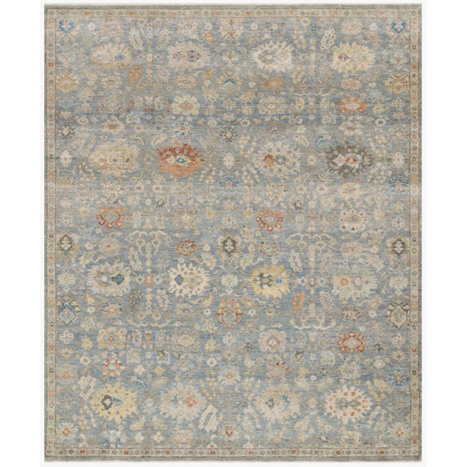 Floral patterned rug with a light blue background
