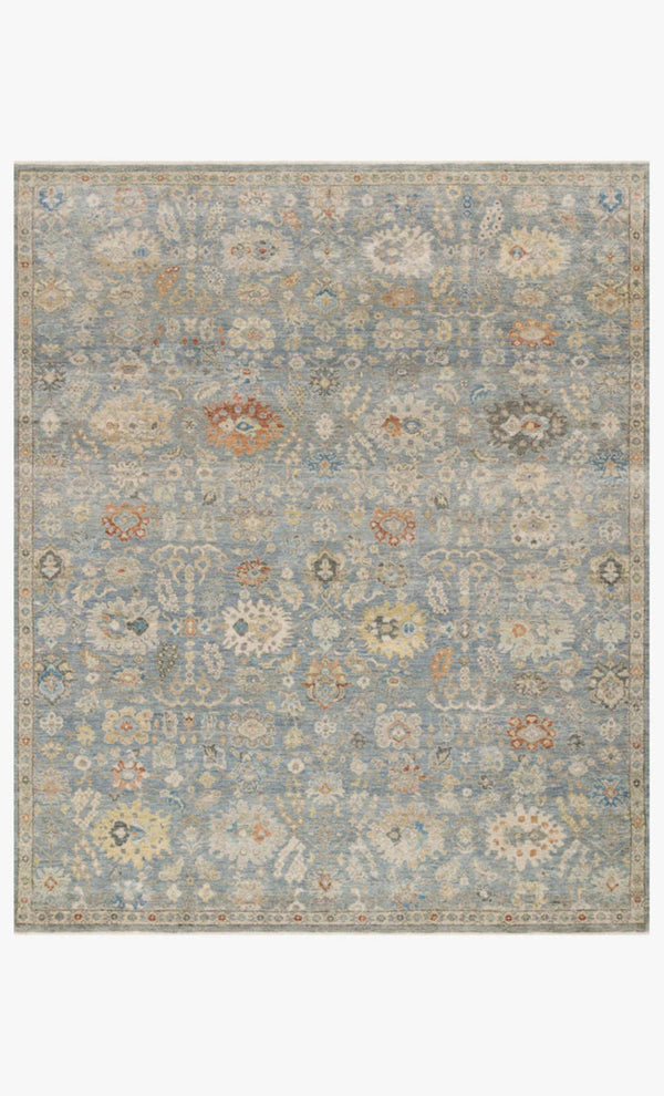 Floral patterned rug with a light blue background