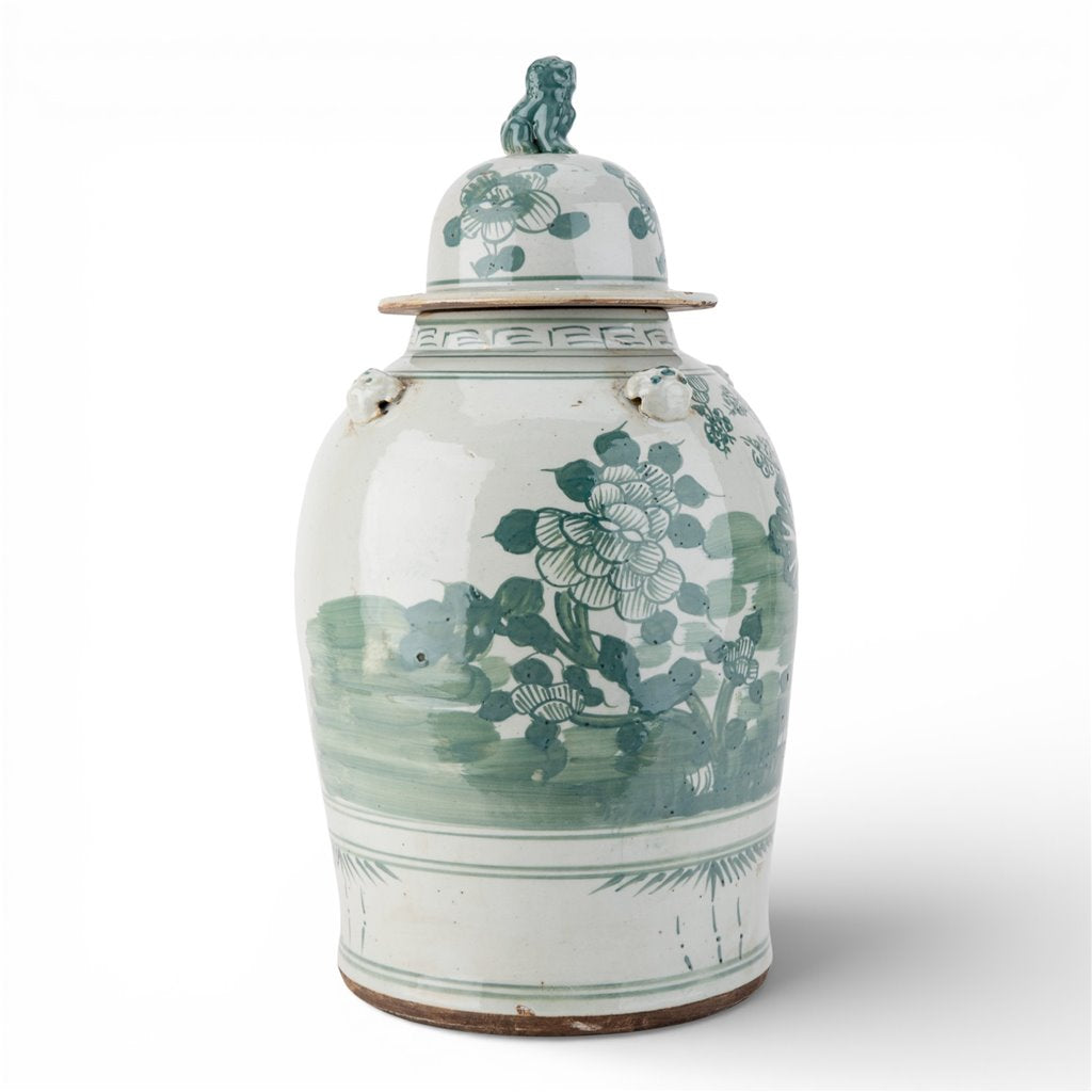 A vintage Chinese porcelain ginger jar with a lid, decorated in a classic green and white hand-painted style with floral motifs and a landscape scene.