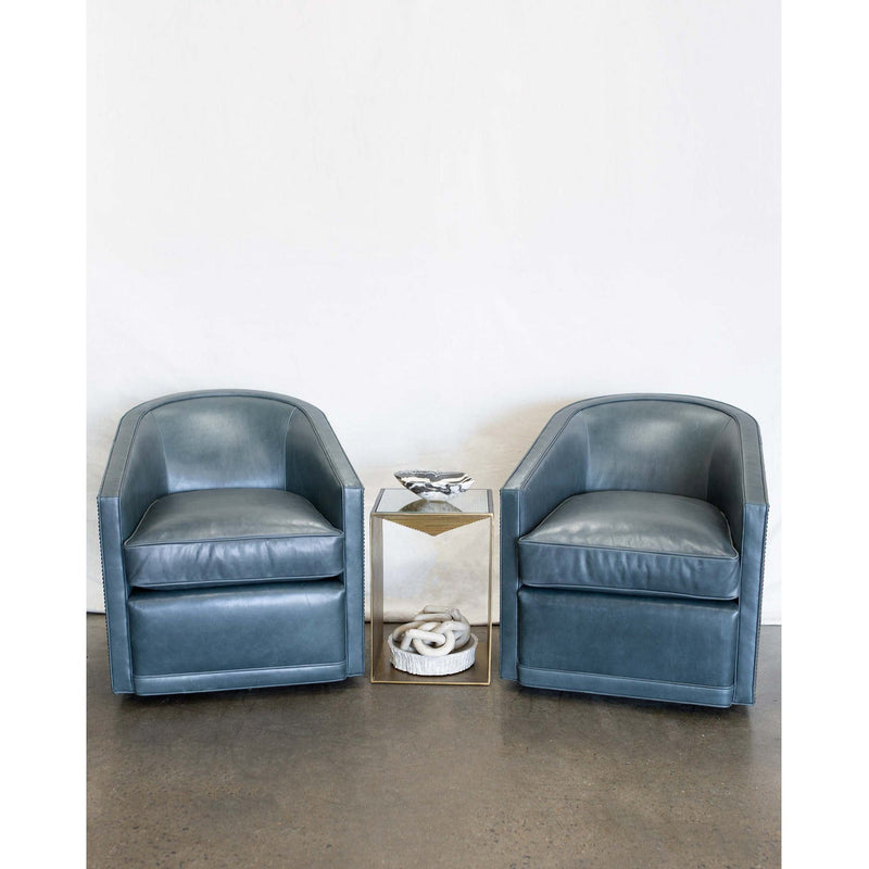 The Radcliffe Swivel Chair is one of our favorites for comfort and looks. It features a curved barrel back with sloped arms. This chair works well with fabric or leather. Duvall Atelier
