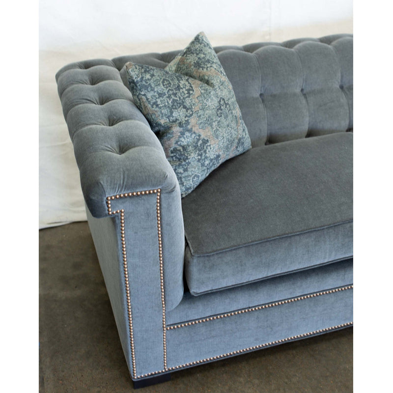 Cozy up with a book in our Chesterfield sofa. With tufting and nail head details the Chesterfield is available to order as fabric or leather. duvall atelier