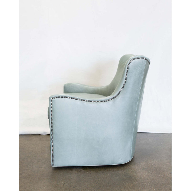 Our Peyton swivel chair continues to be one of our best sellers. The Peyton is built to the floor featuring soft curves and nail head trim. This chair is perfect to enjoy drinks and conversations with friends. Duvall Atelier