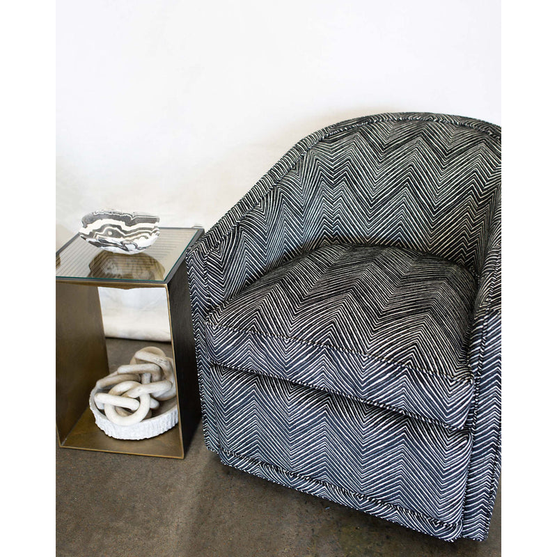 The Radcliffe Swivel Chair is one of our favorites for comfort and looks.   It features a curved barrel back with sloped arms.  This chair works well with fabric or leather.  Shown here in black chenille patterned fabric.  Duvall Atelier
